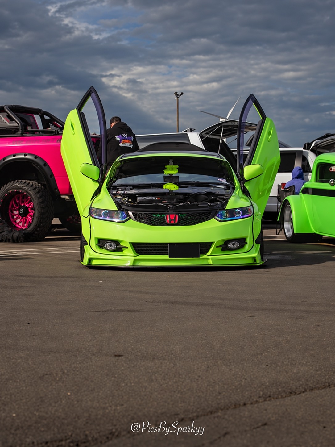 Lime green Honda with vertical doors open
